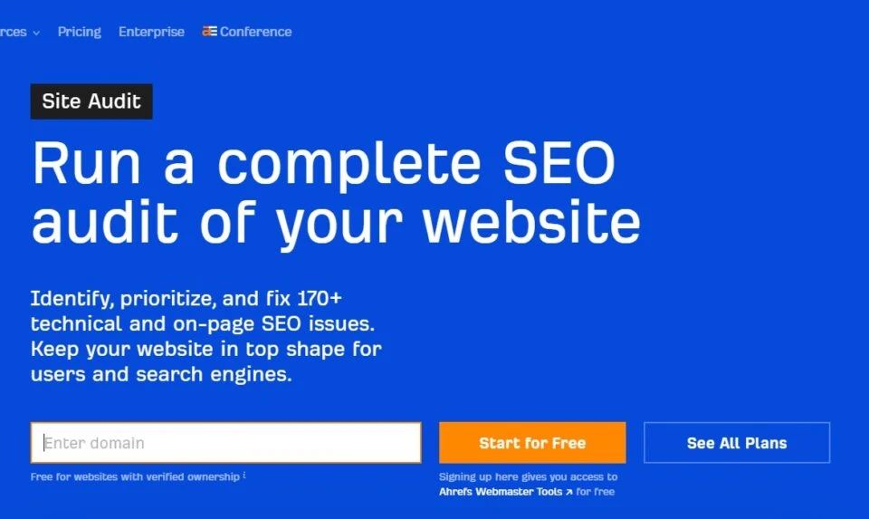 Ahrefs homepage promoting a site audit tool to run a complete SEO audit of a website. The page features text about identifying and fixing 170+ SEO issues, with an input field to 'Enter domain' and a 'Start for Free' button.