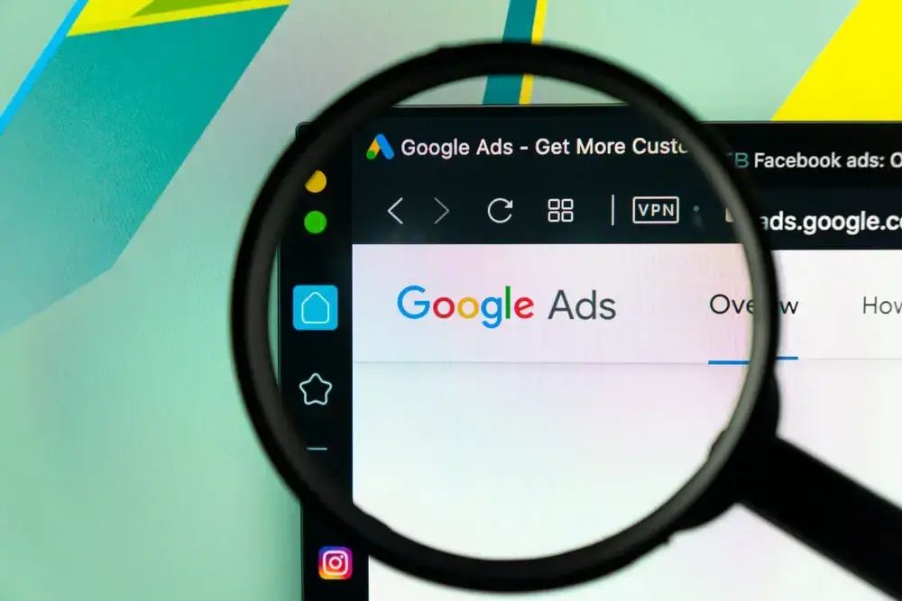 A worried business owner watches a clock while contemplating how long Google Ads takes to start and deliver results