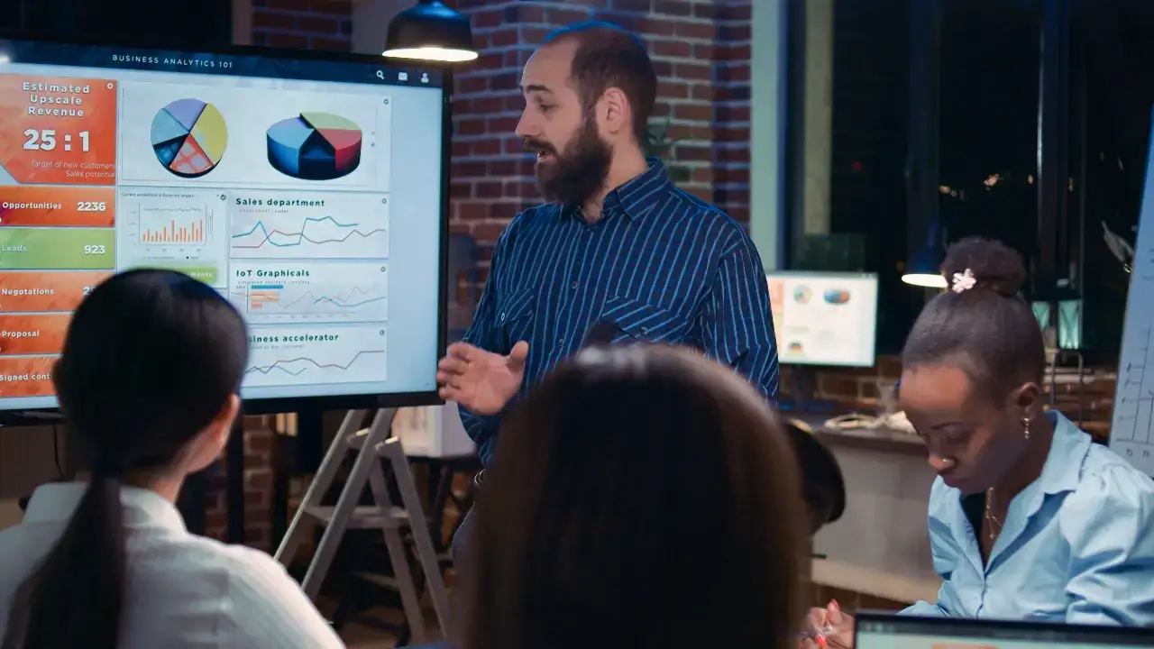 A diverse group of professionals collaborating in a modern office, strategically planning how to invest in digital marketing