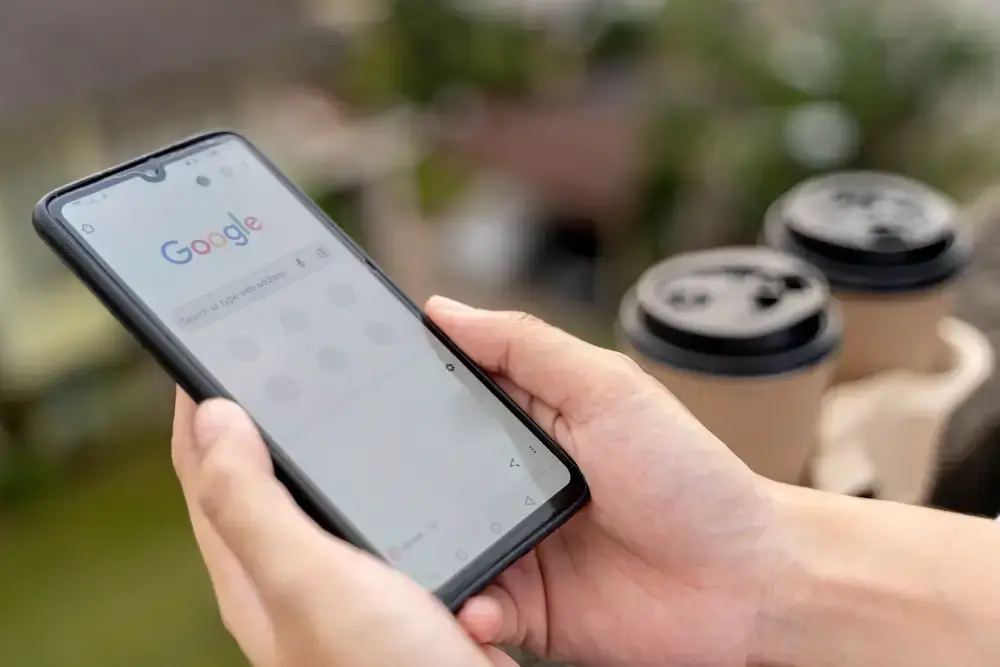 A magnifying glass hovers over a map highlighting a small town, symbolizing the importance of optimizing local SEO strategies