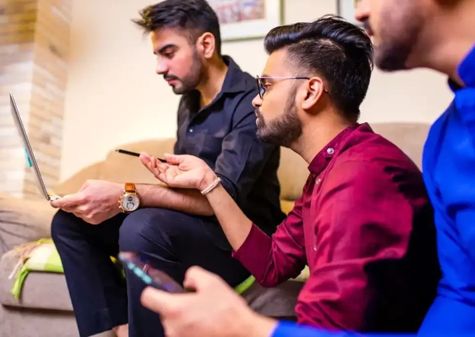 colleagues at a digital marketing agency discussing project details.