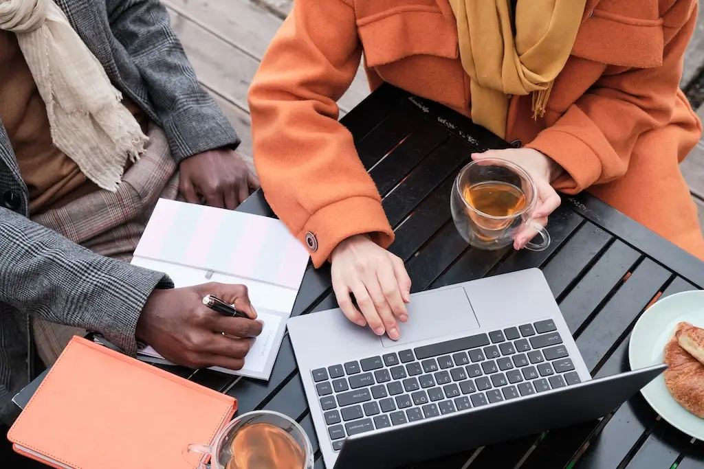 A person typing effective prompts into the ChatGPT interface on a laptop to conduct keyword research with three simple steps