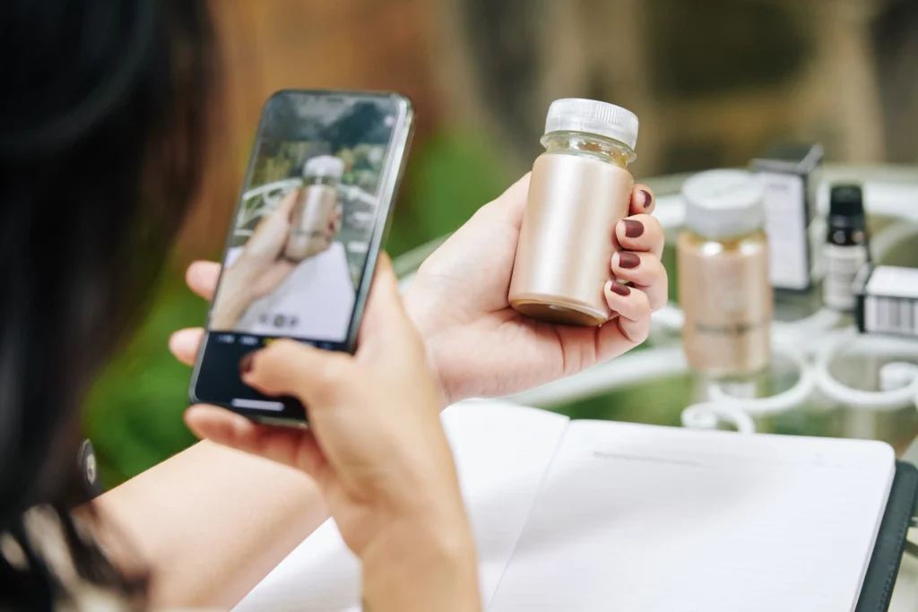 A person holds a phone, aiming its camera at various retail items, demonstrating how to optimize for visual search